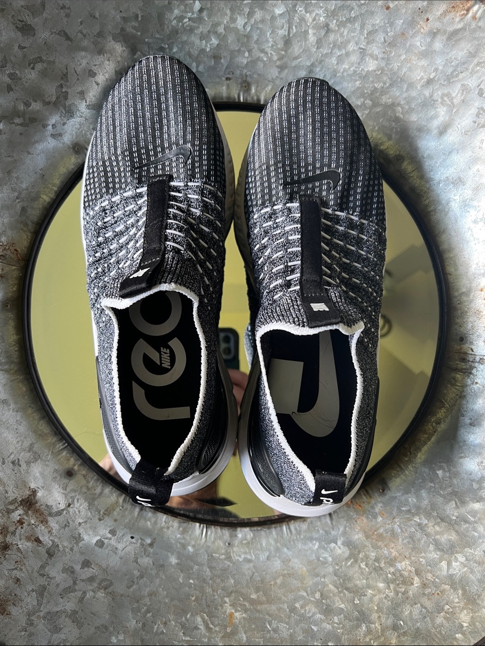 Nike Men’s Black and White Flyknit Slip-On Sneakers
